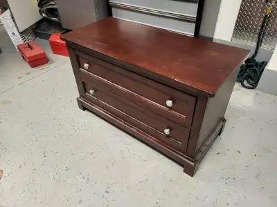 Beautiful dark wood dresser that doubles perfectly as a TV stand. Features two spacious drawers for...