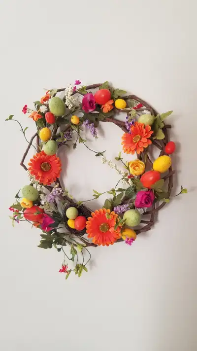 Couronne de fleurs tons orange et rose, View more