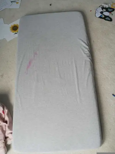 Clean crib mattress with cover, View more