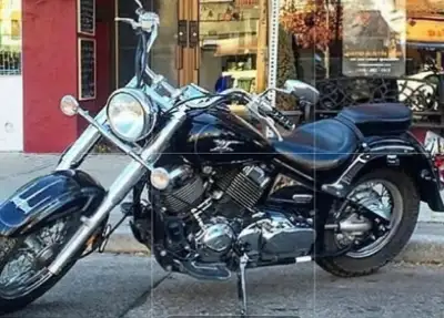 Gently used beautiful bike with bags,detatchable windshield, lock and camping gear bag