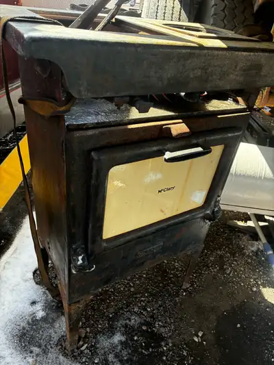 This is an antique McClary cast iron stove, a beautiful piece of history! As you can see in the pict...