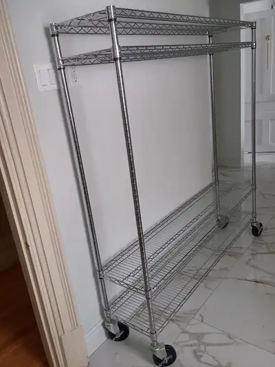 14"W x 60"L x 60"H. 4 shelves, 4 posts, 4 casters (5" diamatre) with brakes