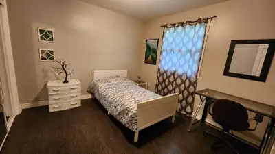 Super clean , quiet, furnished room for rent in family friendly niegburhood in a basement and upper...