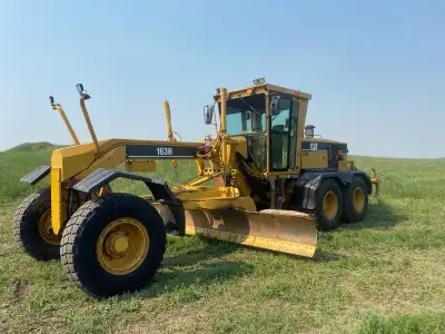 12005 hrs, 14ft blade c/w 2 ft extension, wing and ripper, new rubber. New Cat hoses throughout mach...