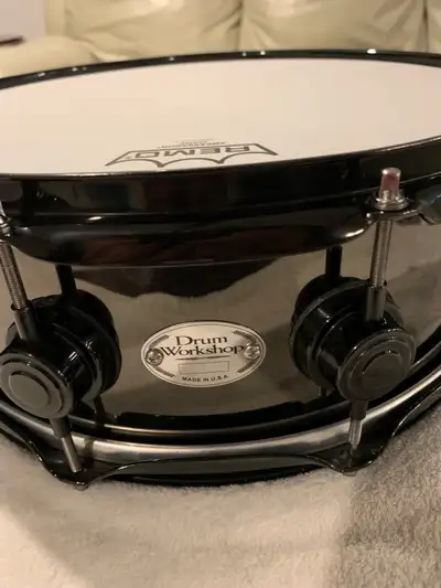 DW 14x5 nickel over brass snare in fantastic condition. Black on black finish, 10 lug, Remo heads wi...