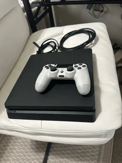 PlayStation 4 in like-new, mint condition — barely used and, View more