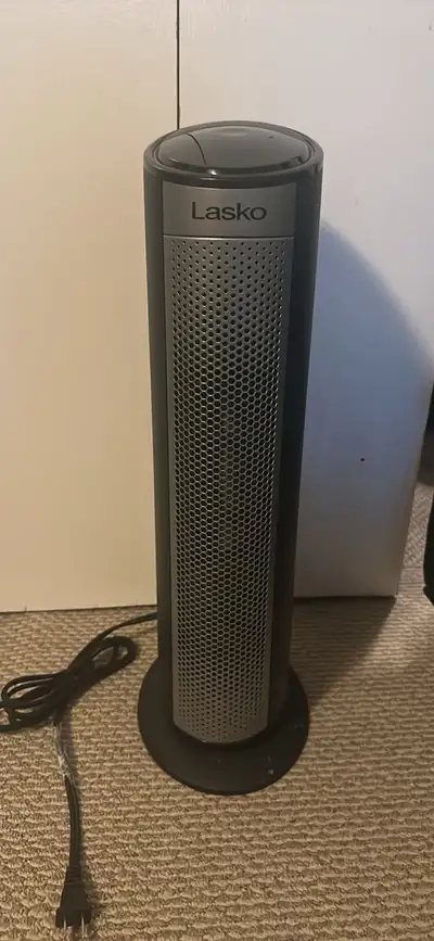 WhatsApp 2275075842 This is a Lasko 22-inch ceramic tower space heater, featuring a sleek black and...