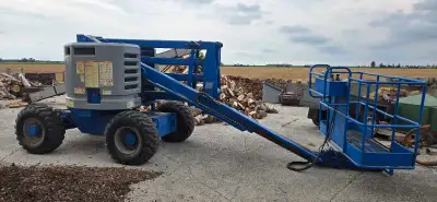 Late 90s Articulating boom lift - Genie Z-45/25 model. 4 Wheel Drive. Works but could use some TLC....