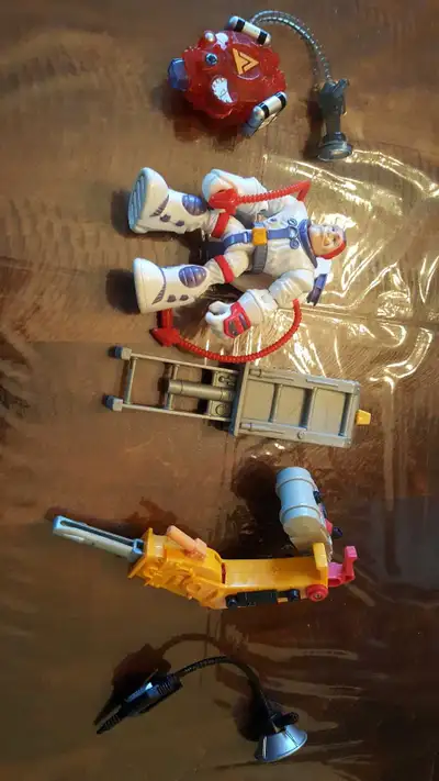 Fisher Price Astronaut with attachments.