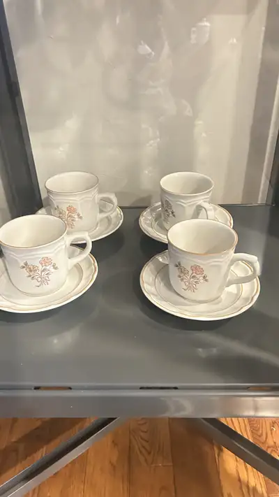 Elevate your tea time with this charming set of four Cordella Collection Stoneware tea cups and sauc...