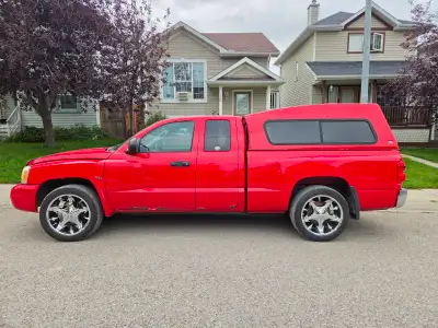 2006 Dodge Dakota extended cab. One owner. Comes with matching topper and after market wheels and wi...