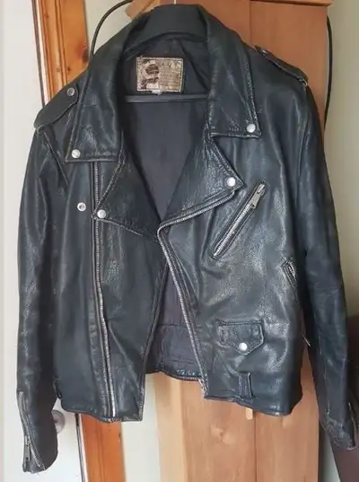 Three Jackets, two zip in liners, chaps, vest, two pairs of boots size 9-10, a dress outfit for your...