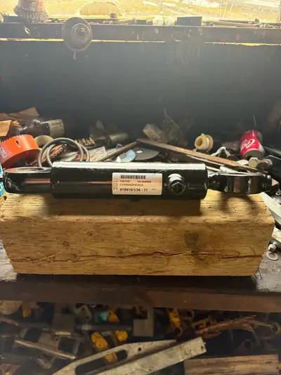 Make me an offer -John Deere 413 tilt cylinder and delimbing knife. Brand new part number in picture...