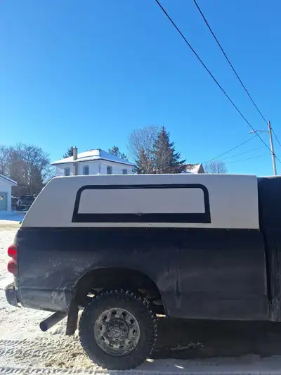 8' truck cap, solid construction, locks don't work but can be replace if you need to, rear door is n...