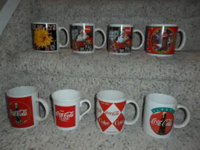 Coca-Cola Mugs. New condition. Top row- $8 each, bottom row- $5, View more