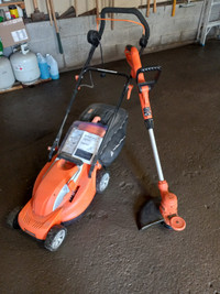 Used electric lawnmower and trimmer