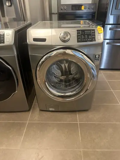 This is a Samsung front load washer, ready to tackle your laundry needs with its efficient design an...