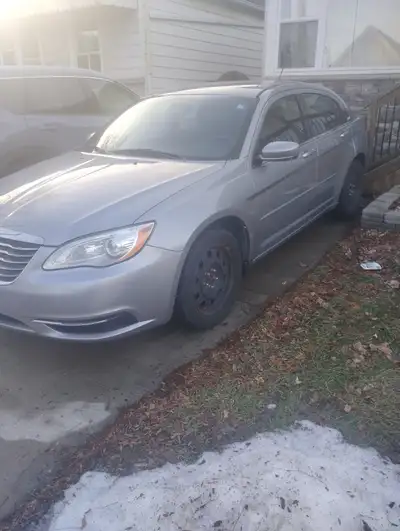 For sale is a silver 2013 Chrysler 200, 4 door sedan with 215,000 klms, the car runs and drives grea...