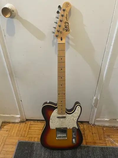Up for sale is this pre-owned NRJ Luthier Custom Shop style electric guitar, featuring a classic sun...
