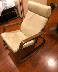 Rocking beige leather chair with footstool