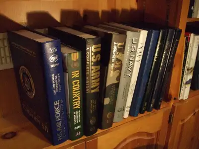 SEVERAL MILITARY BOOKS ARMY, NAVY, AIR FORCE, MARINES, AND MANY MORE THE BOOKS WERE SAVED FOR INVEST...