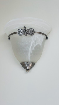 White wall sconces with silver trim