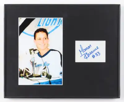 Custom framed display measures approximately 8" x 10" in size and features a cut that has been hand-...