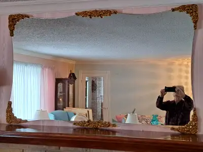 Large wall mirror -- overall measurements 61 inches by 37 inches. Has gold accents on the 4 corners...