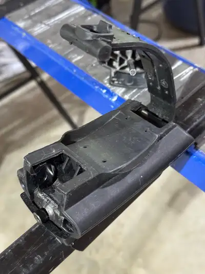 A set of Thule car top roof rack square cross bars 58” in length with universal attachments, and loc...