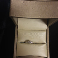 Engagement ring. 10 k white gold. Three diamonds.