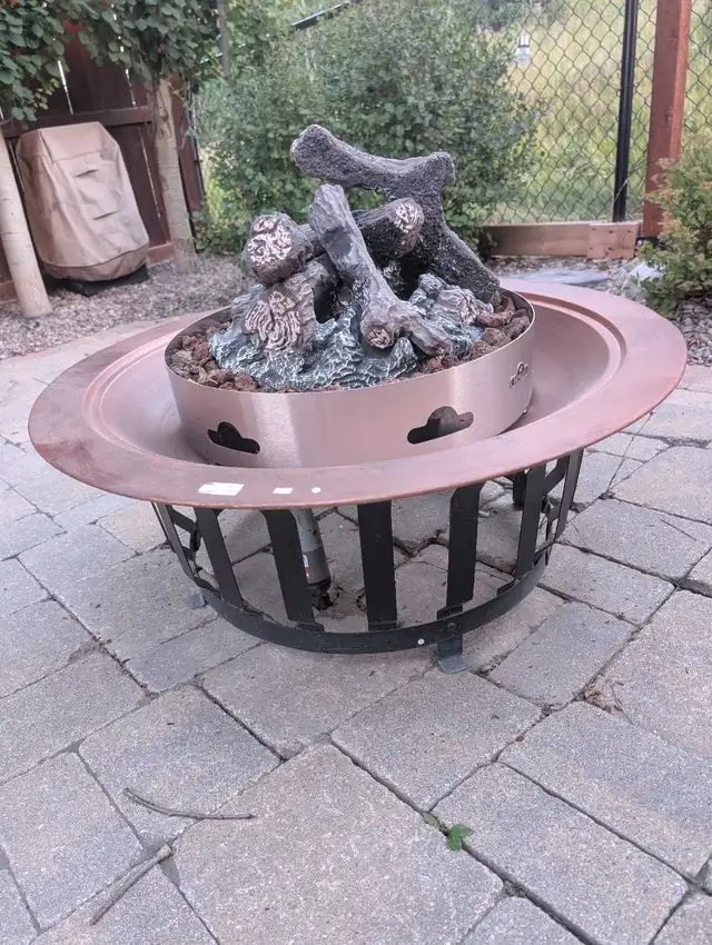 Napoleon natural gas fire bowl with stand. Very good condition.