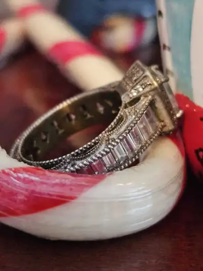 This Vintage Sterling Silver & CZ Gemstone Engagement Ring has unique intricate details she'll love...