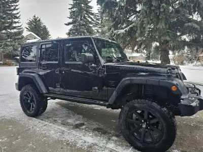 The 2016 Jeep Wrangler Unlimited Sport has 132,000 km, is a capable, four-door SUV known for its rug...