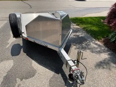 Aluma MC 10 all aluminum with stone shield, spare tire,mag rings EZ lube bearings Weight 505 lbs Box...