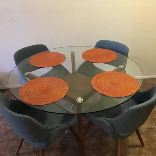 Structube Glass top and solid wood base with a warm nutmeg finish. The table comes with four blue ch...