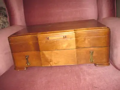 solid wood, one drawer, 17.5 x 12 inches it's originally a flatware chest, but the satin inlays have...