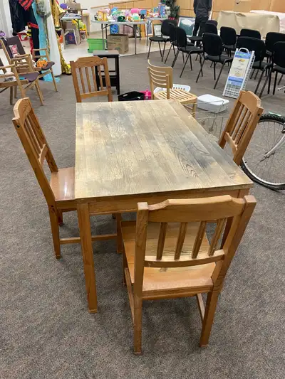 This solid wood table with four chairs is looking for a new home! I am selling it as part of a garag...