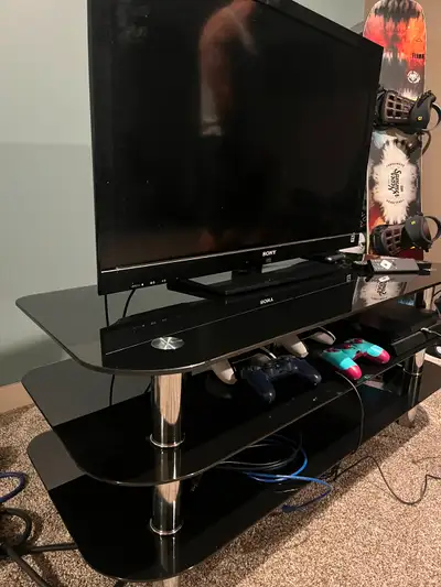 40 inch t.v that works fine with a stand that is in mint condition. Comes with 2 free side tables if...