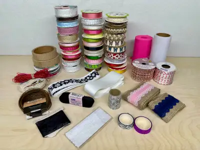 Big lot of around 60 new and near-new rolls of ribbon, lace, cord, and some patterned tapes. Selling...