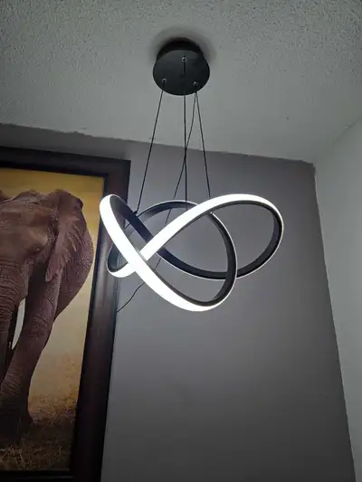 Add a touch of modern elegance to your space with this MAYNA Modern LED Pendant Light Fixture. This...