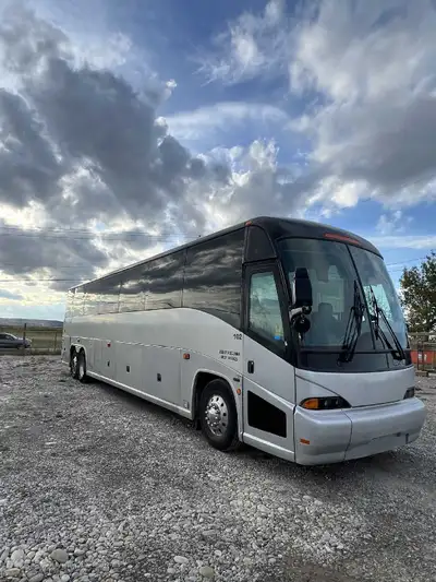 56-Seat MCI J4500 Motor Coach Bus for sale. Includes cruise control, DVD player with TVs, on-board w...
