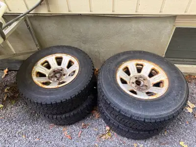 Selling a set of used winter tires mounted on rims, sized at 225/70R15 and 235/75R15. * 2 x Tire Siz...
