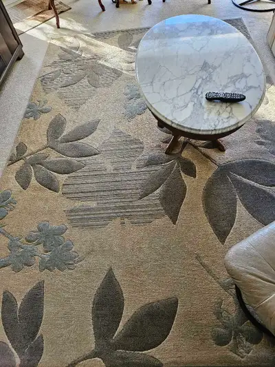 Beautiful living room suite, part of estate sale. Cream leather couch (bit of wear on one arm of cou...