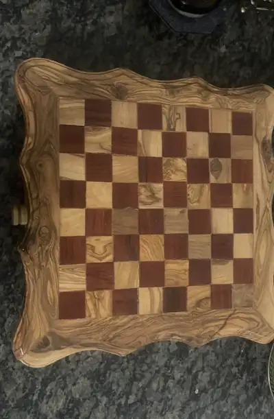 Enhance your game nights with this beautifully crafted wooden chess set, featuring two built-in stor...