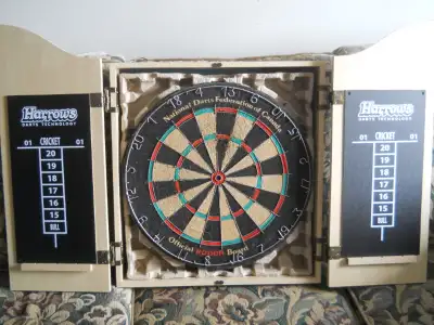 Nodor Dart Board not sure if ever used the Harrows Cabinet is New, come with 3 darts, or best offer