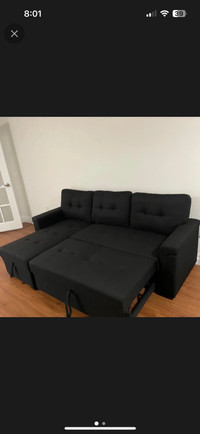 Free delivery- black sectional couch with pullout bed - storage