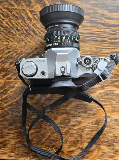 Vintage Canon AE-1 35mm film camera, a fantastic piece of photography equipment. This used camera is...