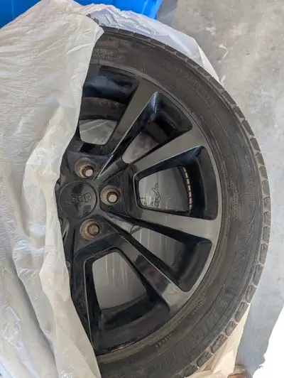 Michelin tires on black alloy rims. Came off a jeep