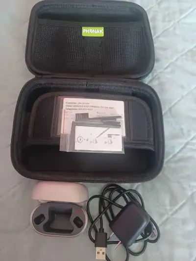 For sale Phonak New Hearing Aid Charger in case. Never used $50.00.