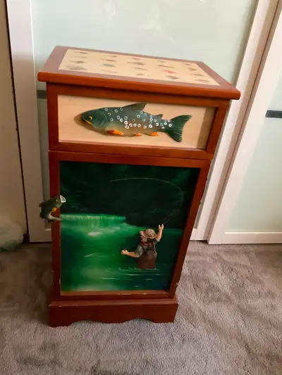 Vintage fishing man decorated accent cabinet. Great Father’s Day gift.
